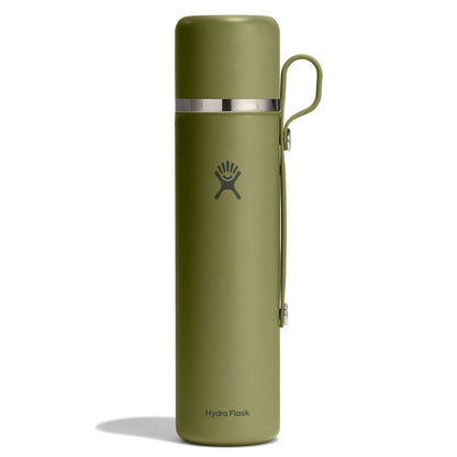 Olive-green Hydro Flask insulated thermos-style bottle with smooth matte finish, shiny silver band near top, matching green side handle, and logo on front.