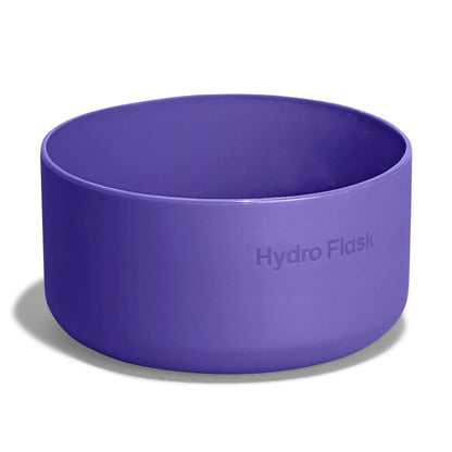 Purple Hydro Flask silicone bottle boot with smooth rounded shape, thicker base, wide open top, and "Hydro Flask" embossed on the side.
