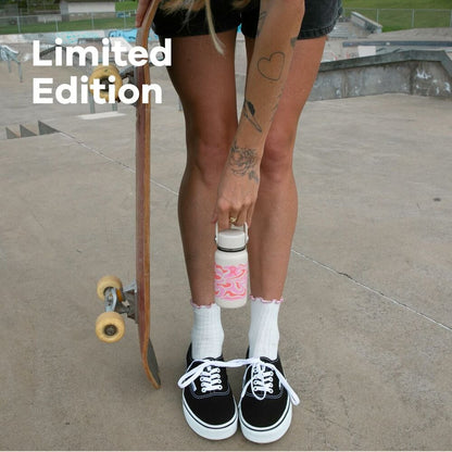 Woman outside holding skateboard and Hydro Flask mini bottle with Callie Groove design and text overlay stating Limited Edition